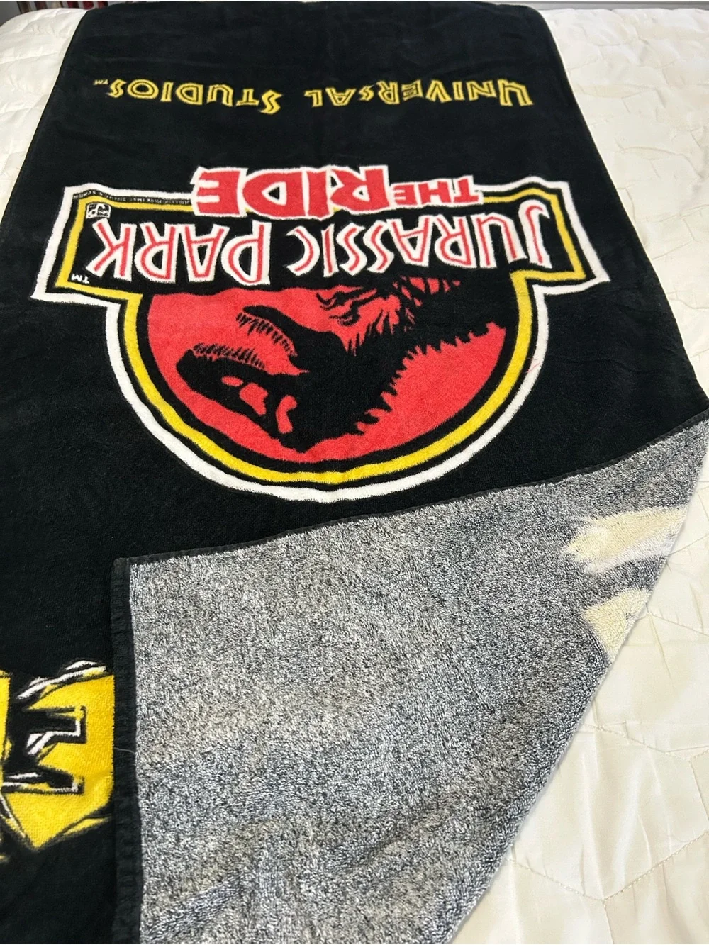 vintage 1990s Jurassic Park The Ride beach towel featuring the iconic movie logo